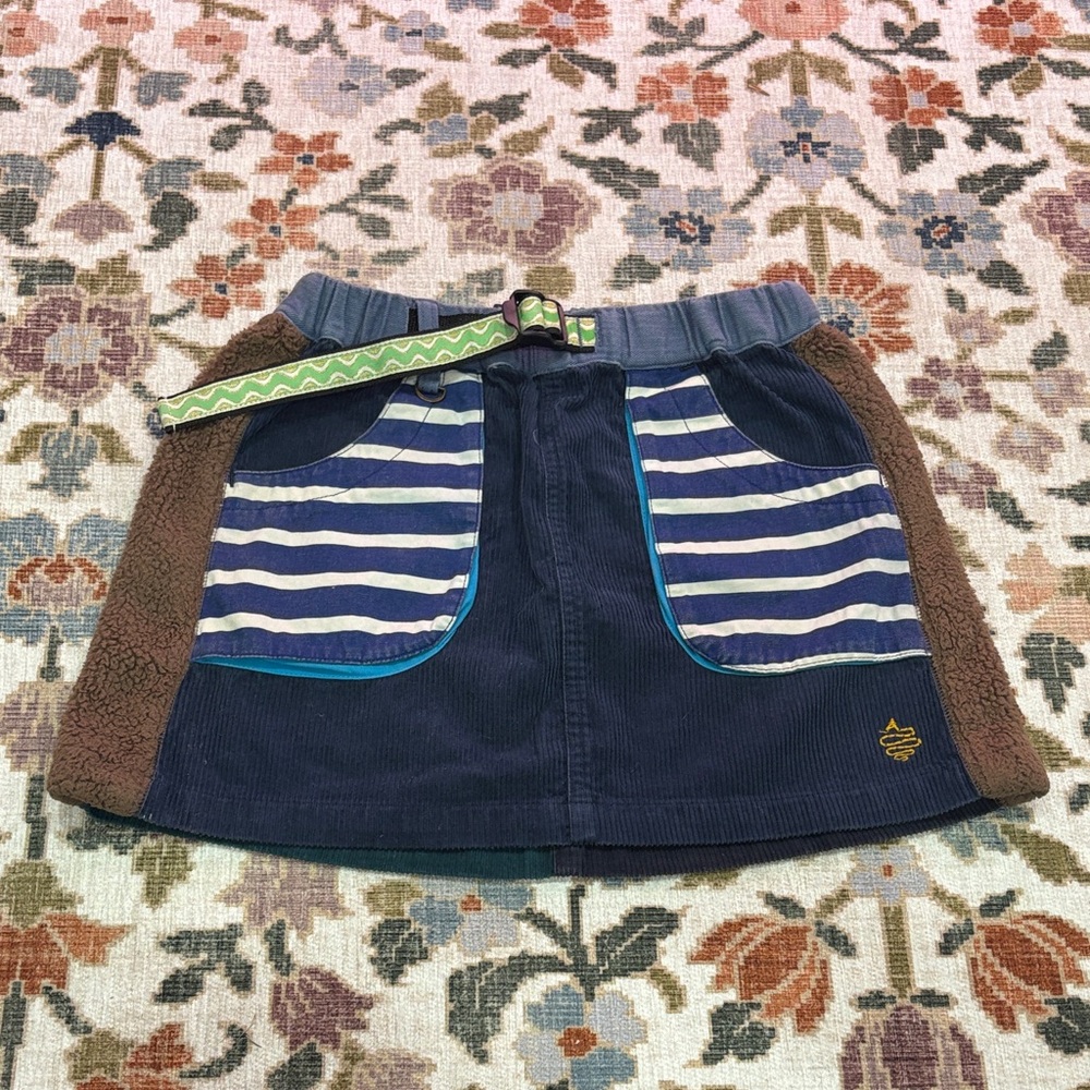 Corduroy Mini Skirt with fleece side and striped navy pockets and green belt